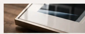 Close view of a framed photograph beneath glazing