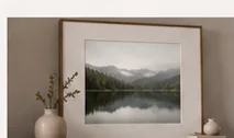 Framed landscape photograph arranged in a calm interior