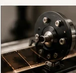 Photographic film mounted near a drum scanning assembly