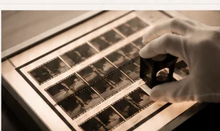 Photographic film being inspected on a light table